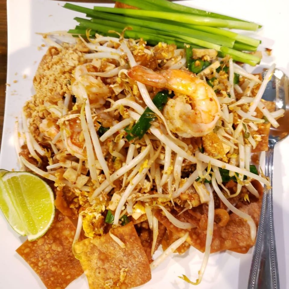 Pattaya Bay Thai Restaurant's Pad Thai with shrimp, bean sprouts, lime, and crispy wontons.